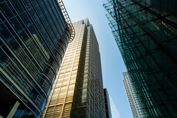 Modern city building architecture with glass fronts on a clear day in London, England
