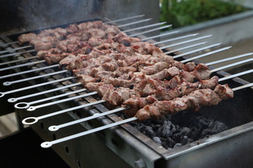 Roasted meat cooked at barbecue with smoke. Traditional eastern dish.