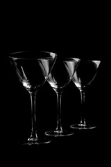 Three black and white silhouette of martini glass