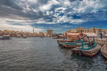 Fototapeta premium Dock of coastal city with multiple boats in water