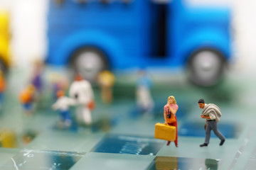 Miniature people: Tourists and shoppers in the city.
