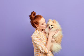 pleasant girl sending her weekend with pet, expressing tender feeling and emotion. close up...