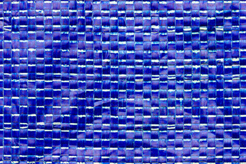 Texture of blue plastic net bag. Concept of recycle product or global warming.