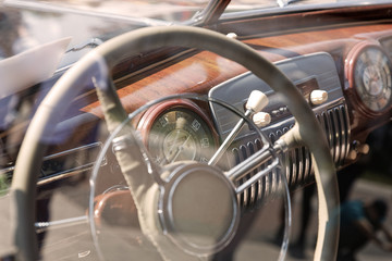Old cabin, console and steering wheel in a vintage retro car