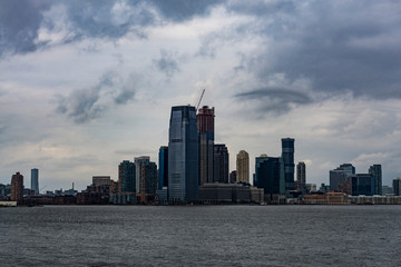 Naklejka premium November 2018 - Skyline of Manhattan, New York City, view from Liberty Island, ferry boat on the ocean