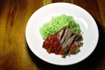  Chinese jade noodles topping slice roasted duck on plate
