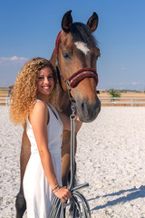 blonde girl with a horse