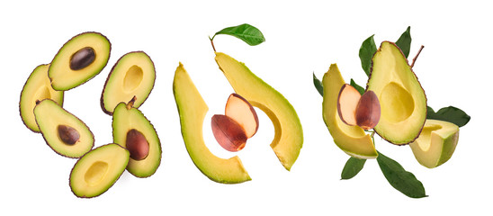 Creative collection set with Fresh ripe avocado with leaves falling in the air.