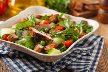 Delicious salad with grilled veal, beetroot and cucumber. Front view.