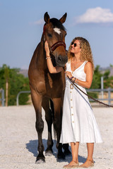 blonde girl with a horse