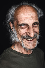 gray-haired mature cunning sly man laughing, rejoicing at good news,showing teeth . old man having...
