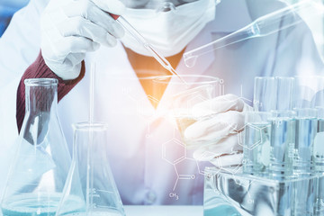 Researcher with glass laboratory chemical test tubes with liquid for analytical , medical, pharmaceutical and scientific research concept.