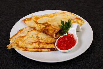 Pancake with red caviar