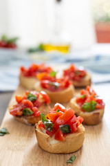 italian tasy bruscehtte with cherry tomatoes and basil