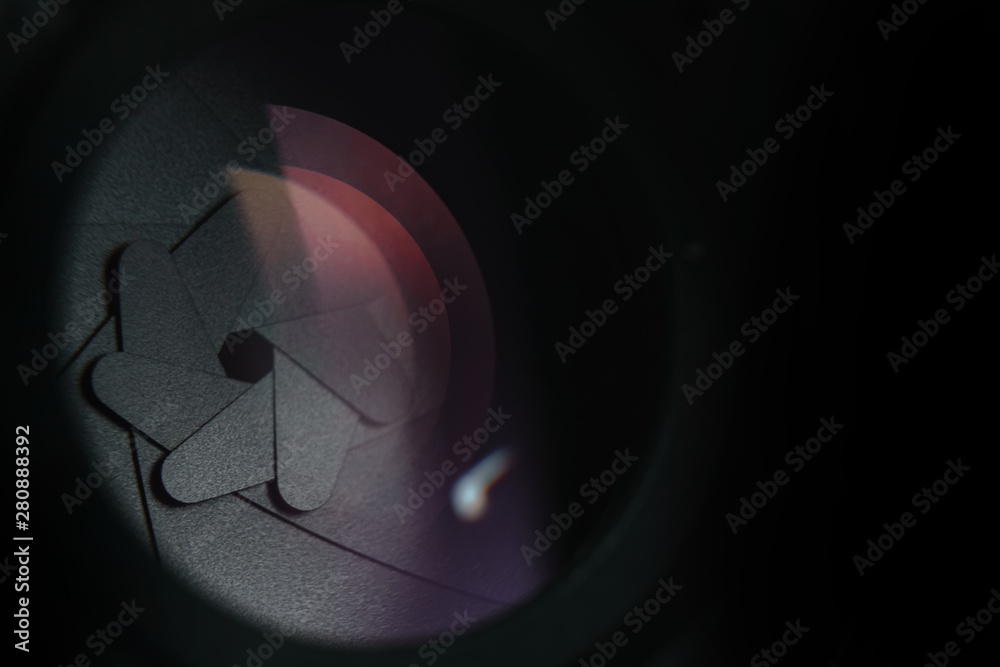 Poster close up beautiful camera lens on a dark background. macro view.
