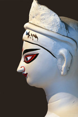 Idol of Hindu Goddess Durga during preparations in Kolkata. Clay idol of Goddess Durga, under...