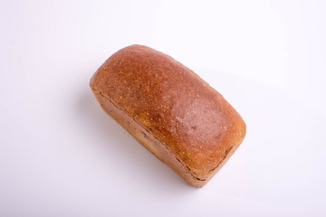 Gray bread on a white background. Baking for food
