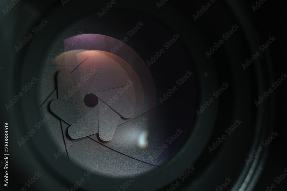 Poster close up beautiful camera lens on a dark background. macro view.