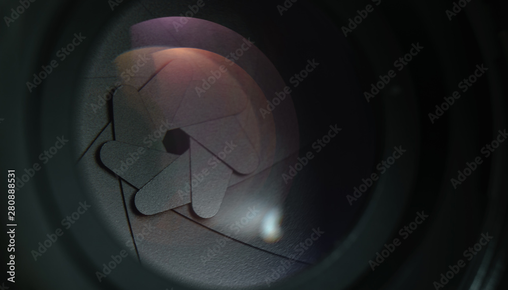 Poster close up beautiful camera lens on a dark background. macro view.