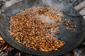Traditional Ethiopian coffee beans roasting, Roasted coffee bean pile