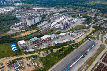 Aerial view of goods warehouse. Logistics center in industrial city zone from above. Yekaterinburg, Russia