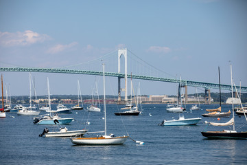 yachts in harbor with bridge