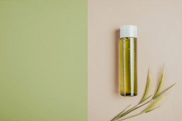 Natural cosmetics, serum for hair and skin care. The concept of organic, natural cosmetics. Flat lay, minimalism, pastel