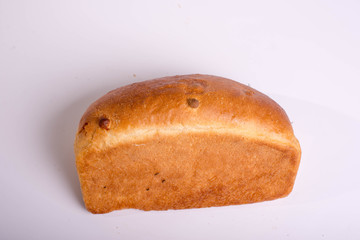 A loaf of bread on a white background. Baked delicious bread isolated