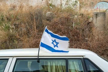 Israeli flag on a car, blue and white Magen David, Israel