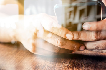 Hands with mobile, double exposure 