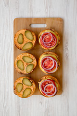 Cooking cheeseburger step-by-step, overhead view. From above, top view, flat lay. Close-up.