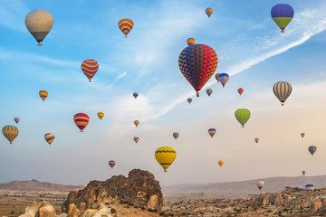 Naklejka premium Hot air balloons flying over the famous landscape of Cappadocia, Turkey
