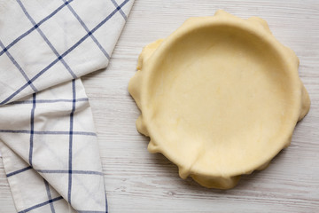 Raw dough for preparation apple pie, view from above. Flat lay, top view, overhead. Close-up.
