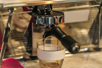 Coffee with various options.Espresso machine making coffee in cup. Brewing coffee with espresso...