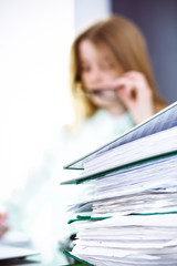 Bookkeeper or financial inspector making report, calculating or checking balance. Audit and tax service concept. Green colored image background