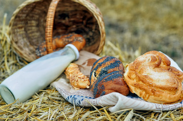 a variety of baked goods and milk in the haystack .
