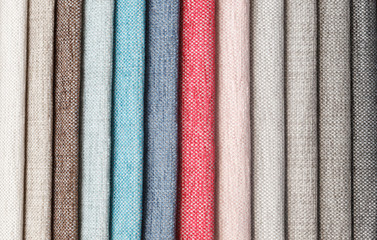 Multi-colored samples of upholstery fabric for sofas and chairs close-up.