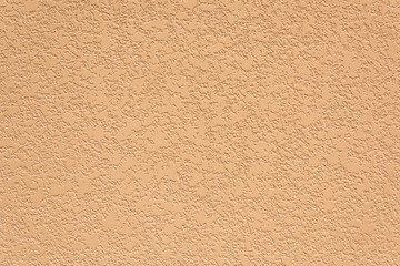 Orange diatom mud rough wall surface background closeup