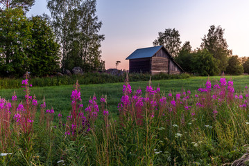 Traditional red nordic wooden shed in Finland during a colorful sunset - 6