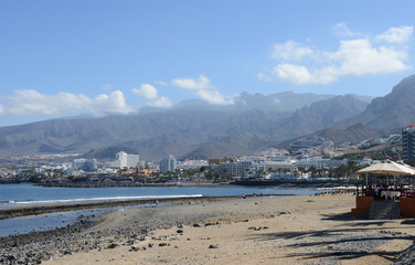 Tenerife coastline nestled under the volcanic mountain ranges