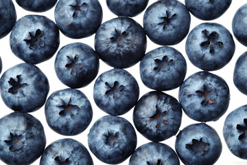 Fresh selected blueberries isolated on white background. Top view pattern