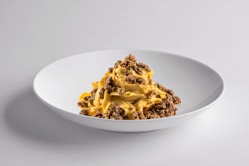 Elegant White round bowl with tagliatelle Bolognese