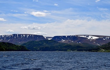 view across the East Arm of the Bonne Bay towards the Tablelands and Lookout Hills  mountain range,...