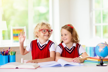 Kids doing homework. Children go back to school.