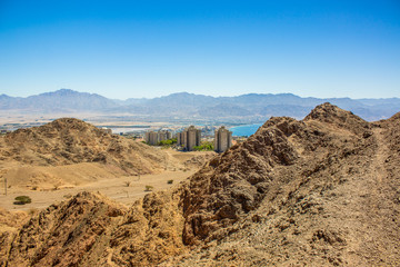 top view of Israeli city Eilat buildings from dry desert rocky mountains scenery landscape place