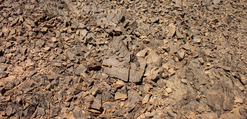 sharp rocky cracked stones wasteland background  