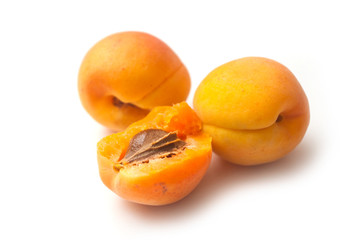 Closeup of organic apricots on white background