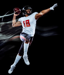 one african american football player man studio shot isolated on black background with light...