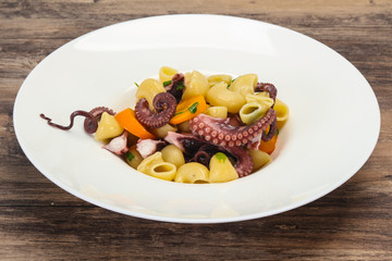 Pasta with octopus and yellow tomatoes