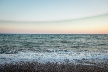 Sea waves. Sea of Crimea. High waves at sunset. Sunny day at sea. Background blue waves. Sand beach. Clean beach.